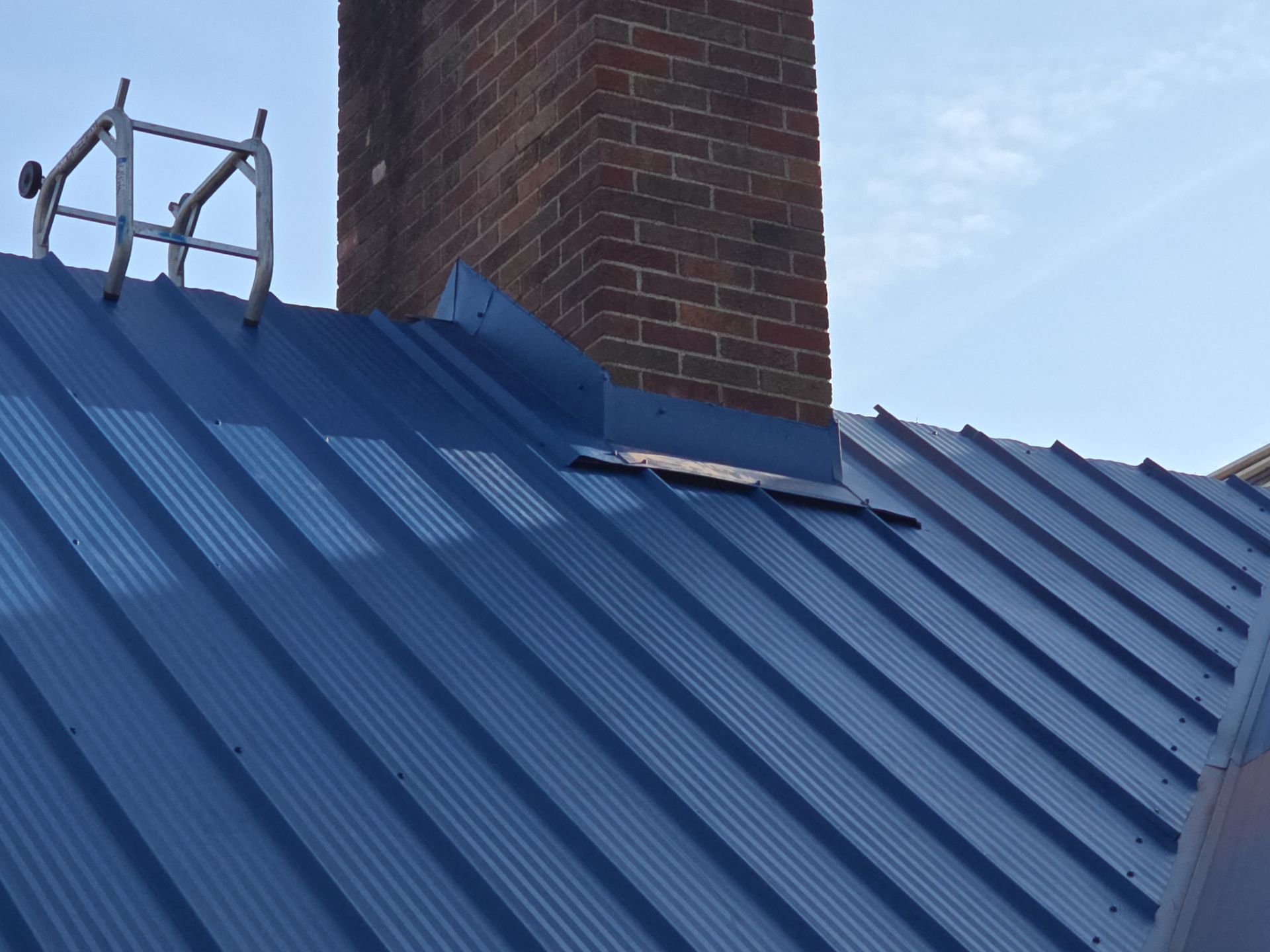 New metal roof and chimney flashing