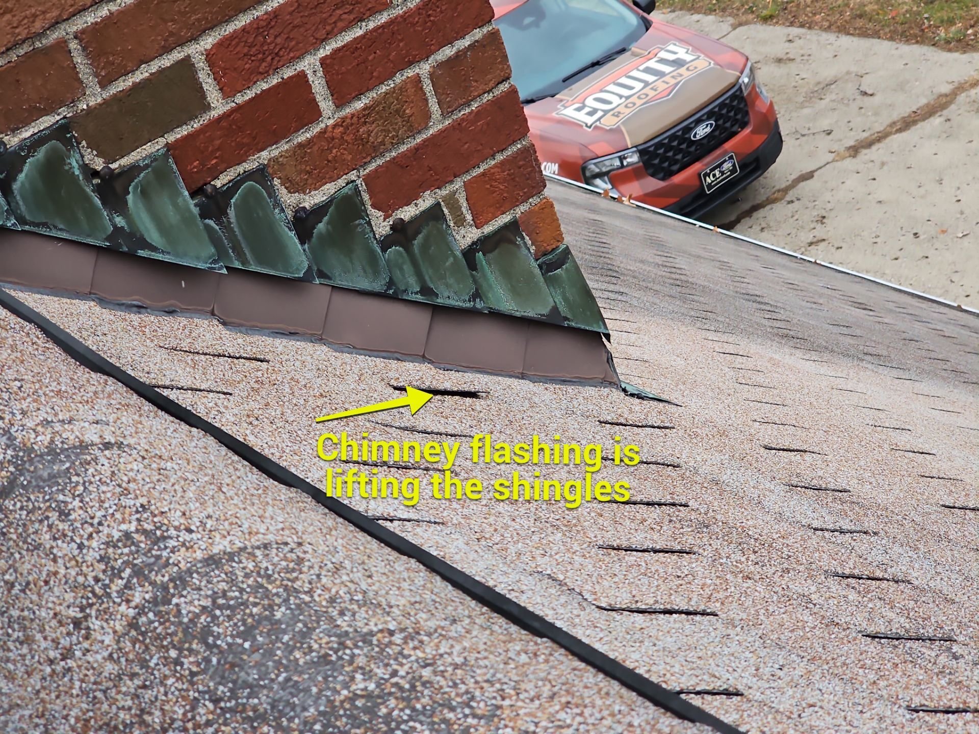 Chimney flashing lifting shingles on Elkhart, Indiana home