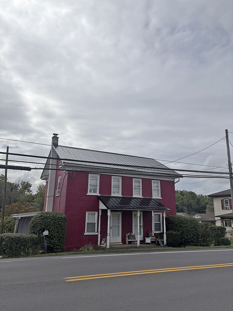 Danville PA home roof replacement using black Pro Appearance metal with smooth panels