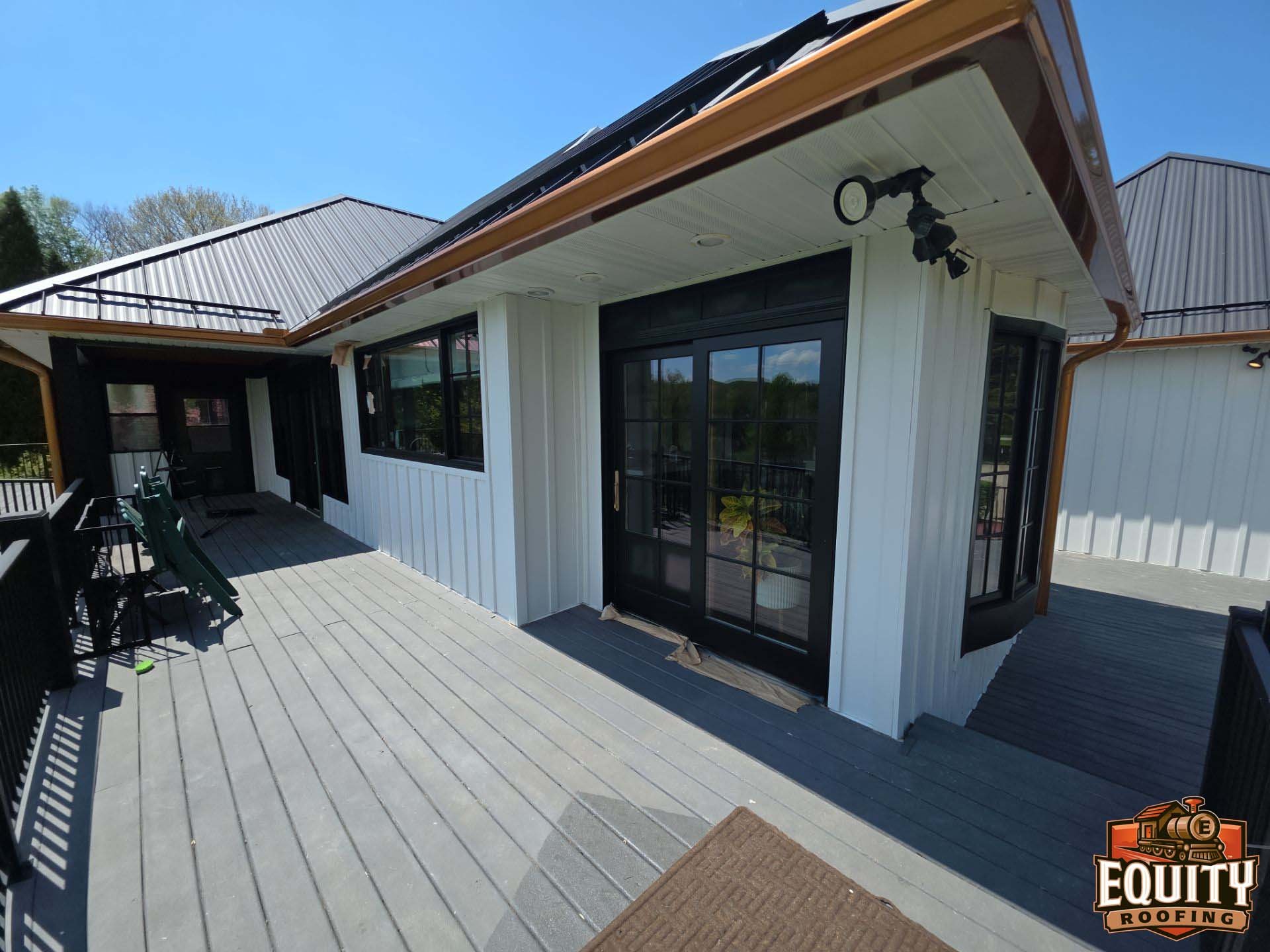 James Hardie white siding with copper gutters on Michigan home