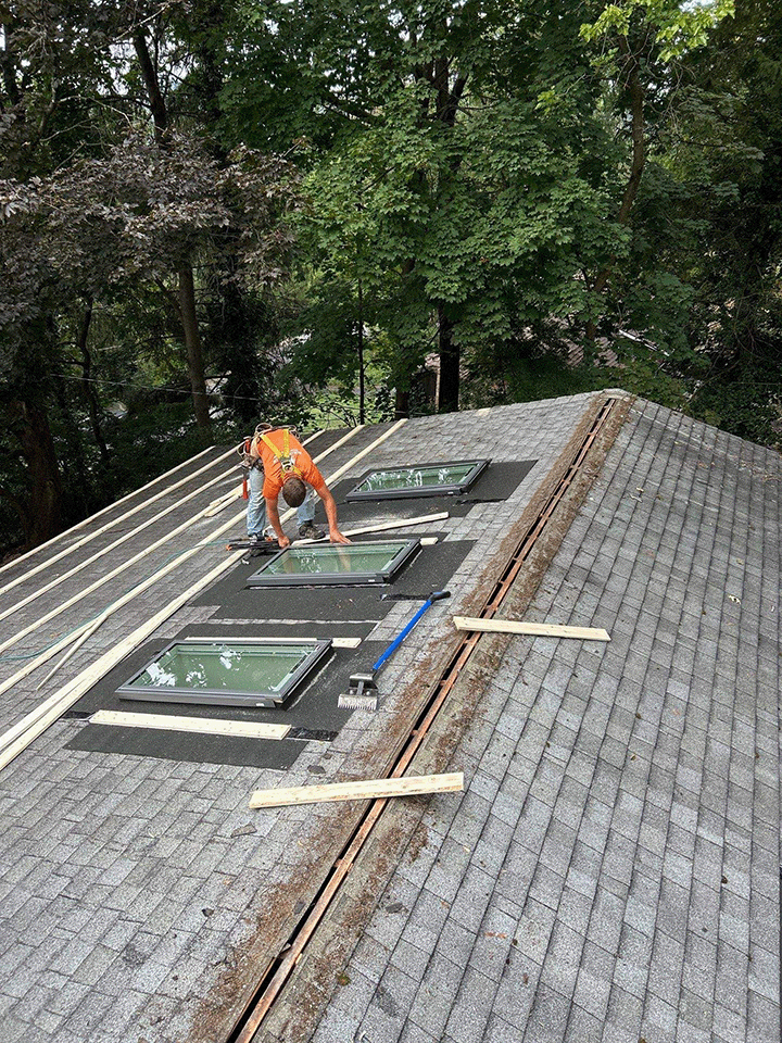 Lath placed around skylights for metal roof overlay installation on Williamsport PA home