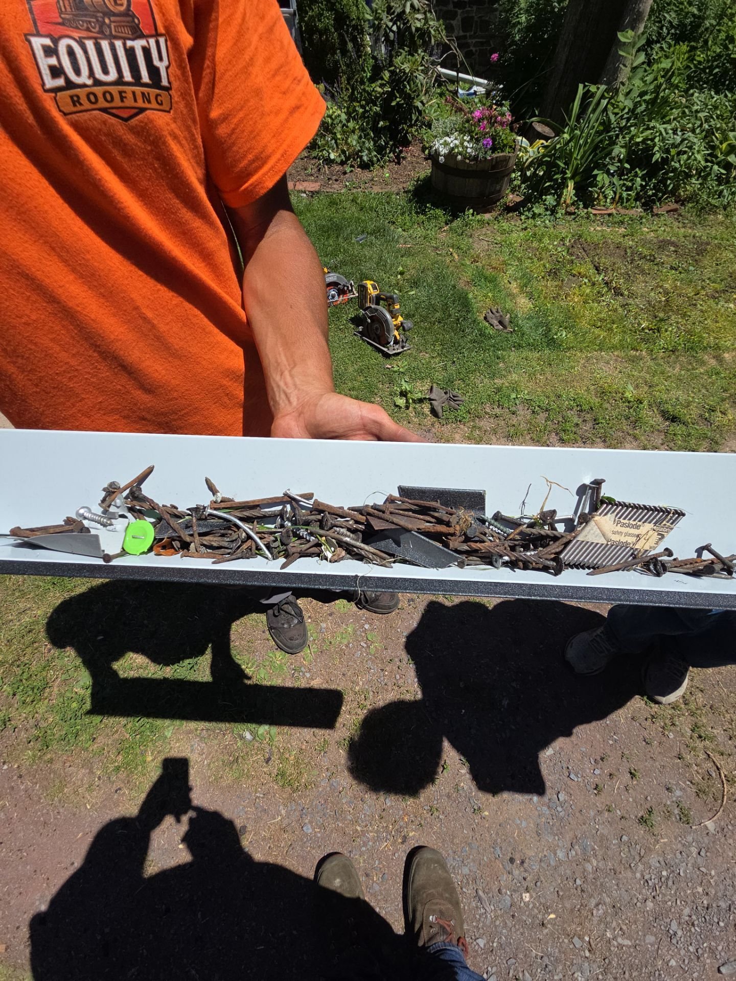 Old nails cleaned up from standing seam metal roof replacement on Northumberland PA home
