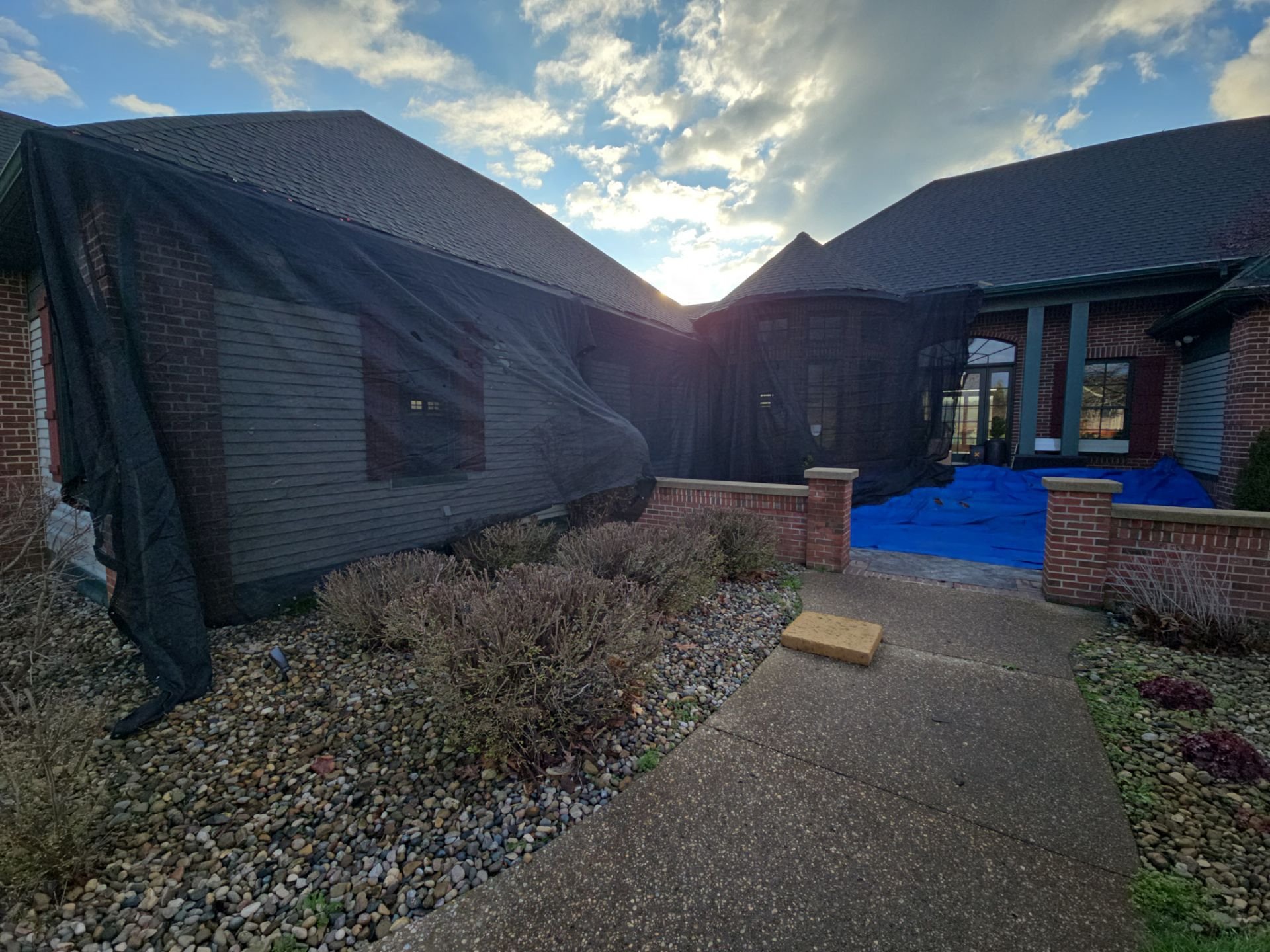 Roof to ground tarping for roof replacement in Michigan