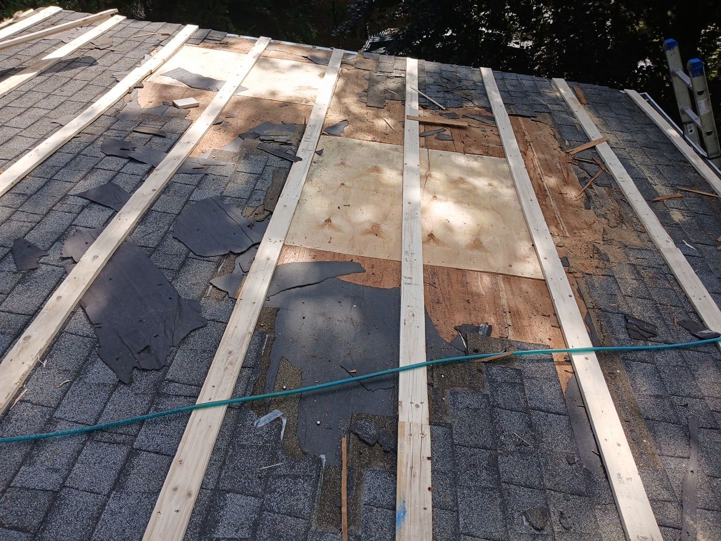 Sheathing replaced on shingle roof in Williamsport PA, lath laid for metal roof installation