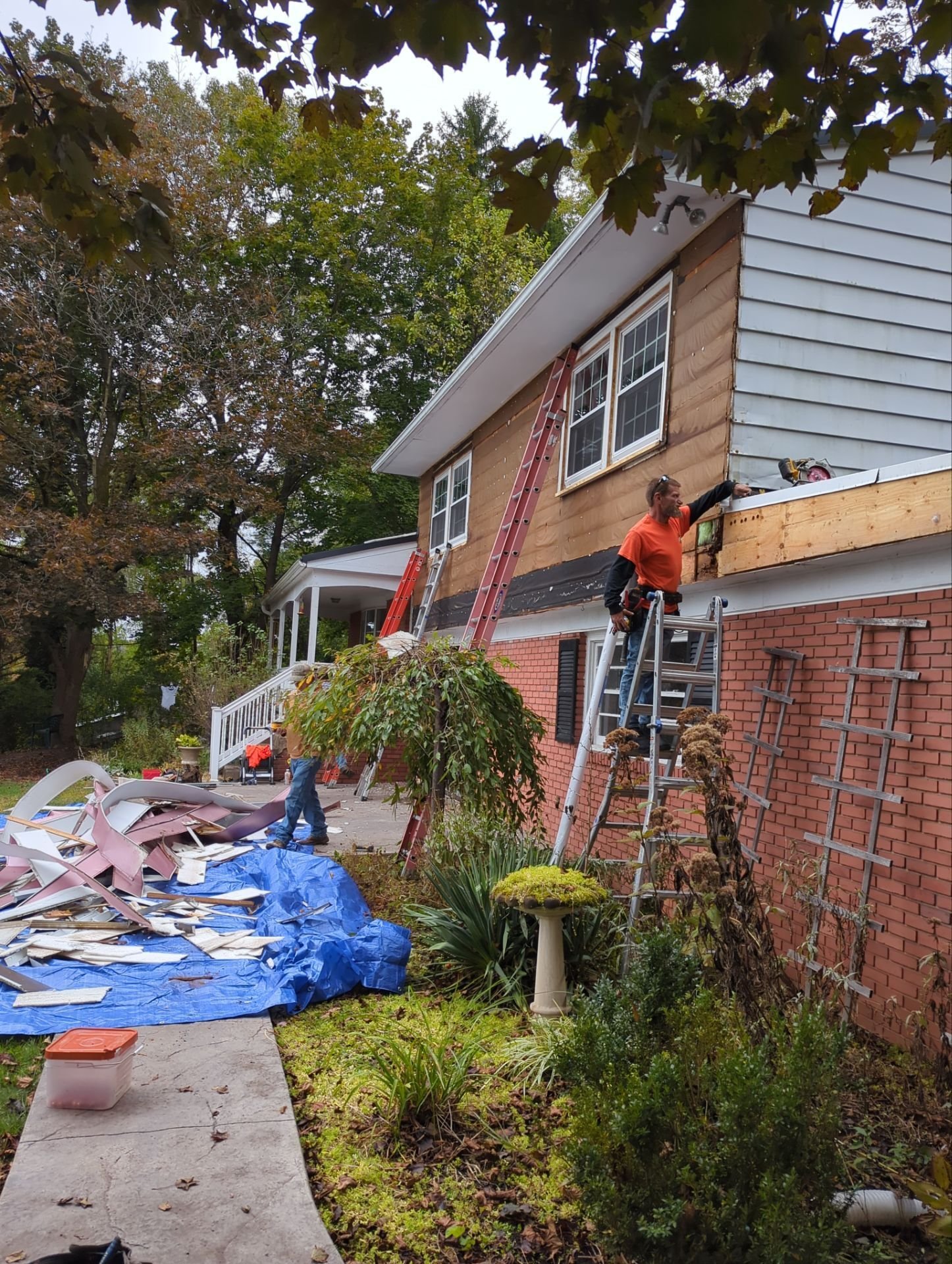 Siding replacement for Williamsport PA home with tarping for clean up