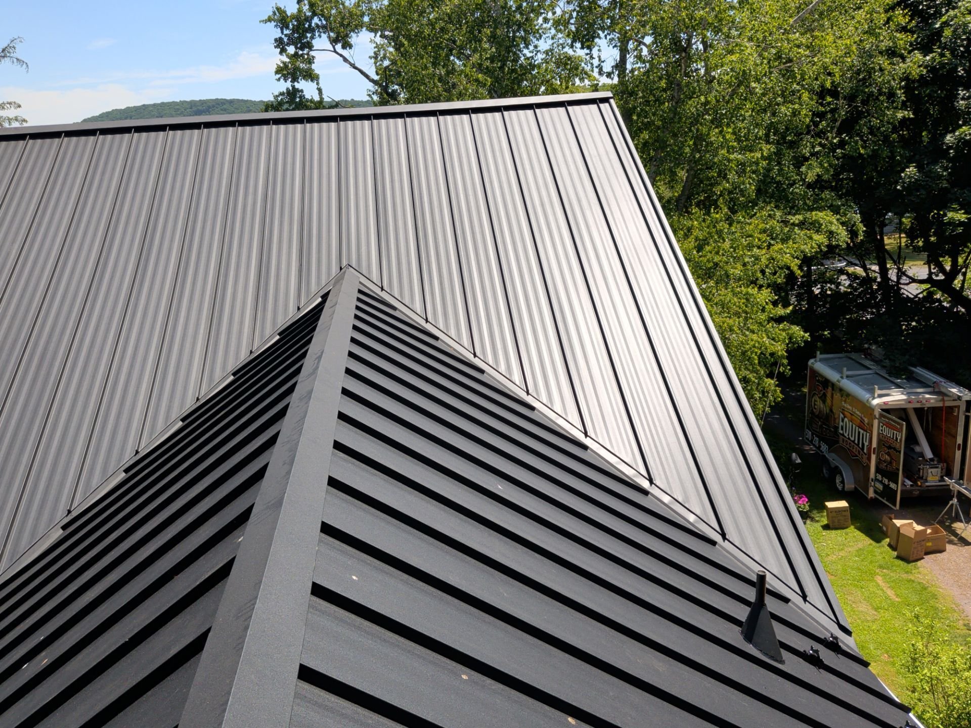 detailed view of striated standing seam metal roof in color black on Northumberland PA home