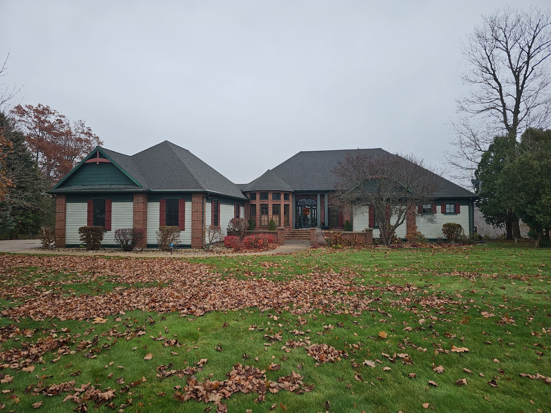 Michigan home with old shingle roof and siding