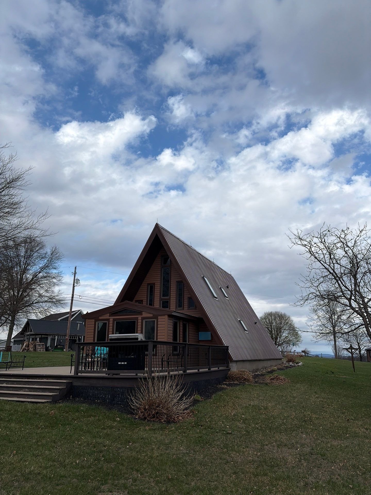 Metal roof and siding replacement for A-Frame home by Equity Roofing in Middleburg PA