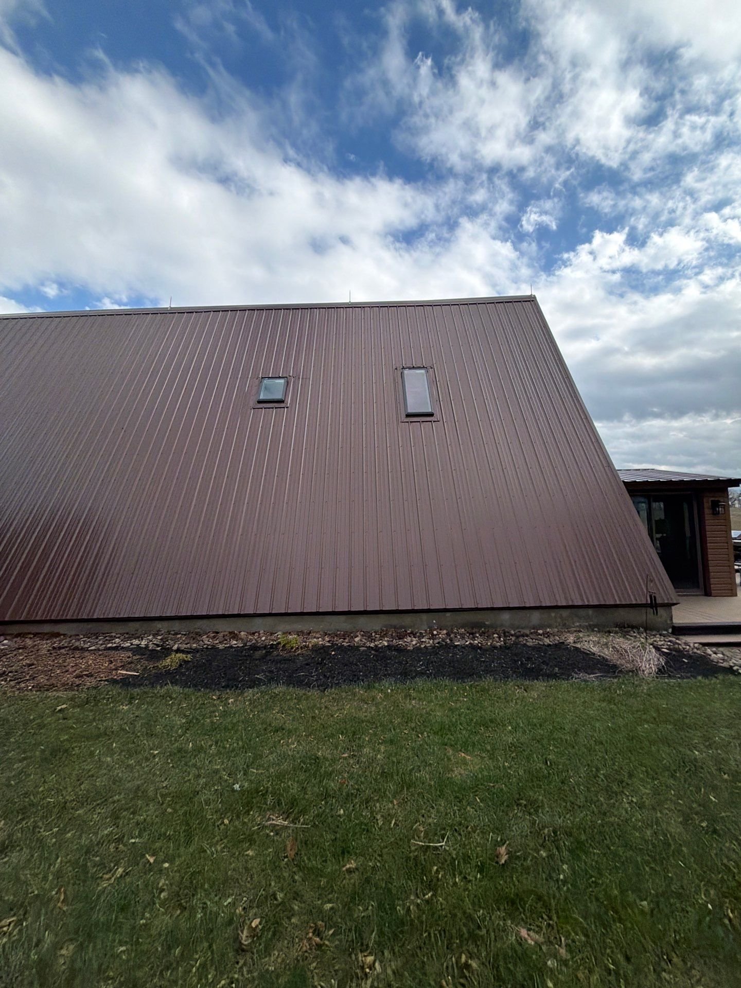 Exposed Fastener metal roof installed by Equity Roofing on A-Frame home in Middleburg PA