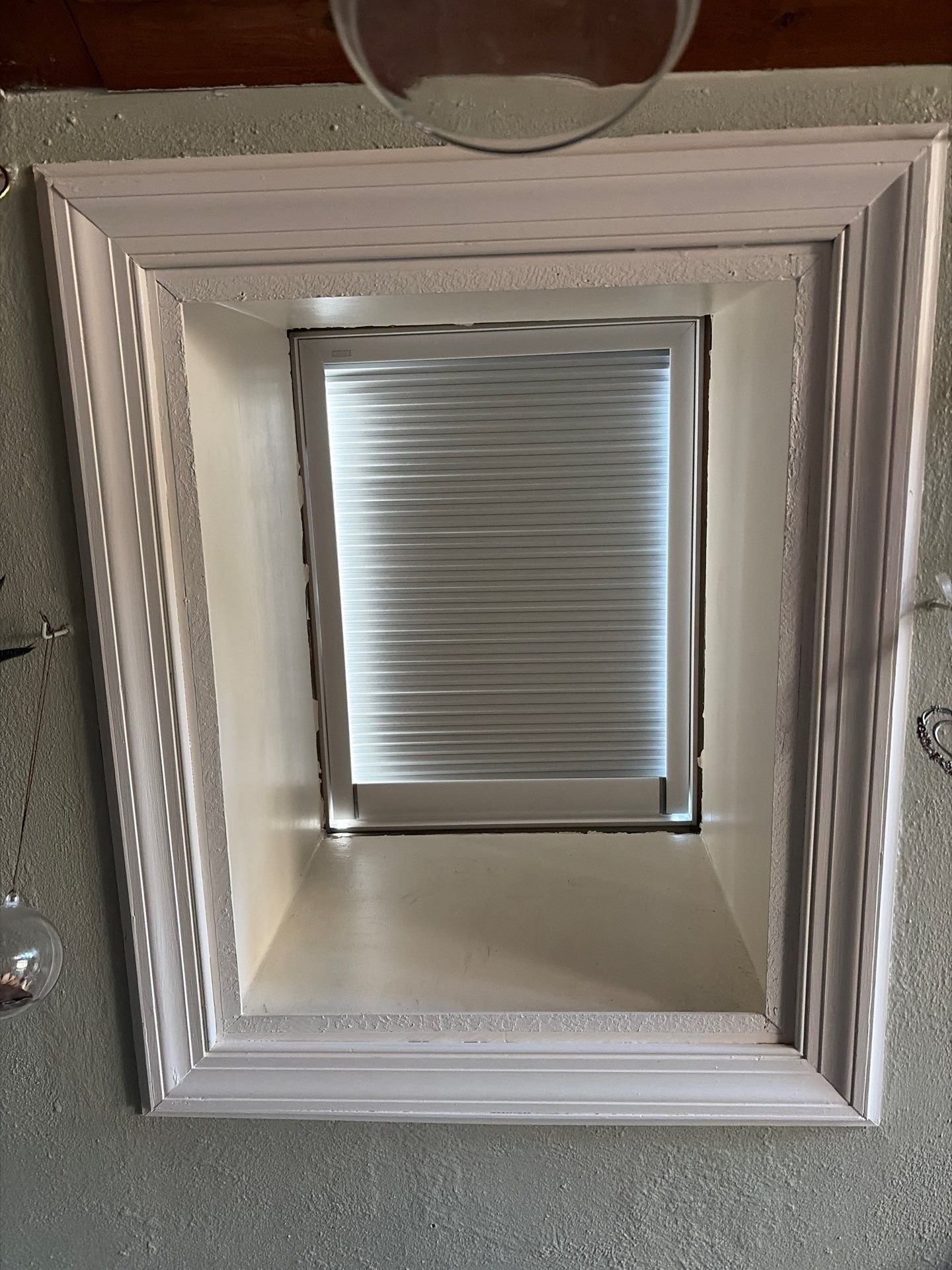 Skylight replaced with remote controlled window shade 