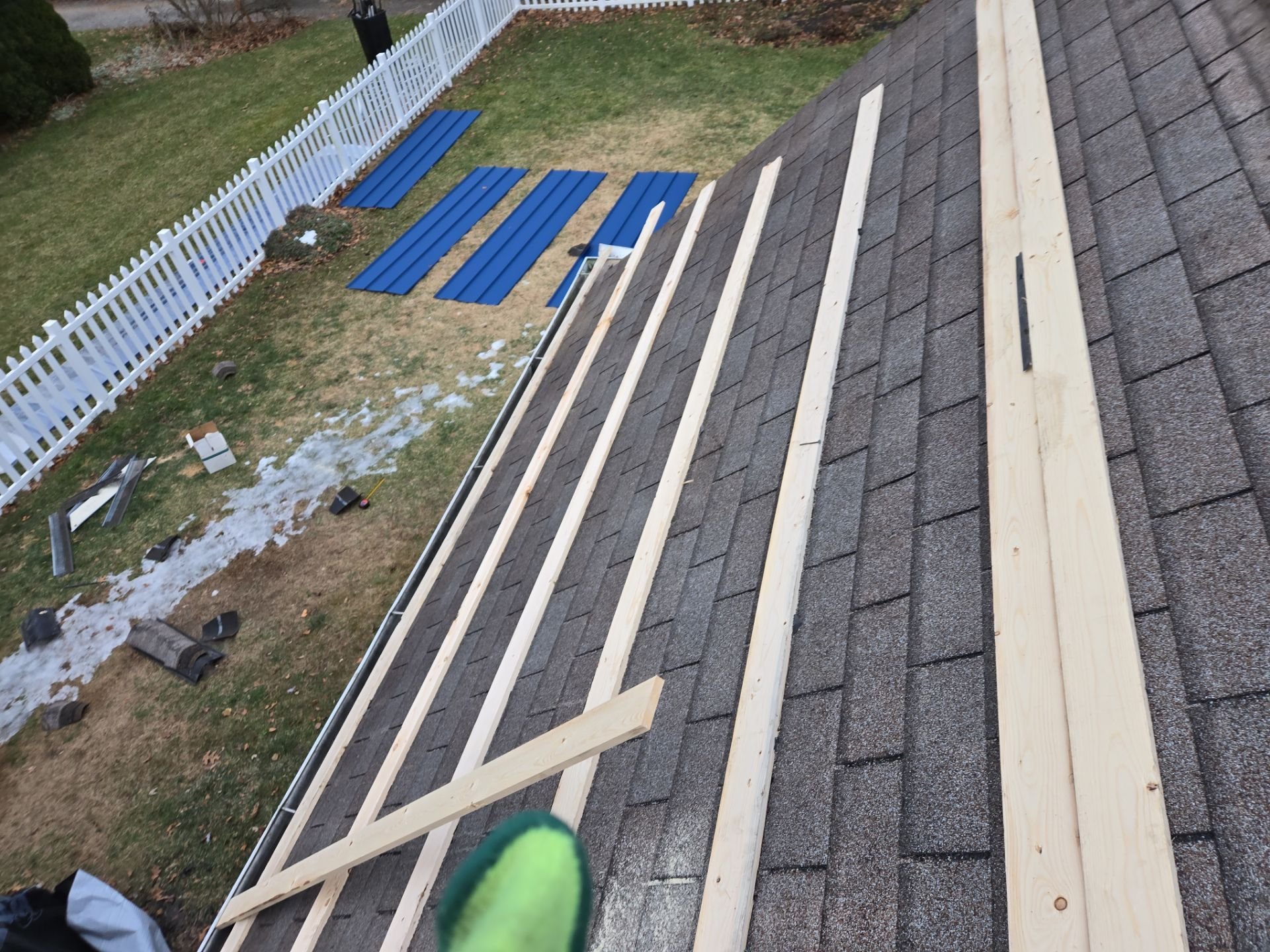 Metal roof over shingle roof in progress for Elkhart, Indiana home