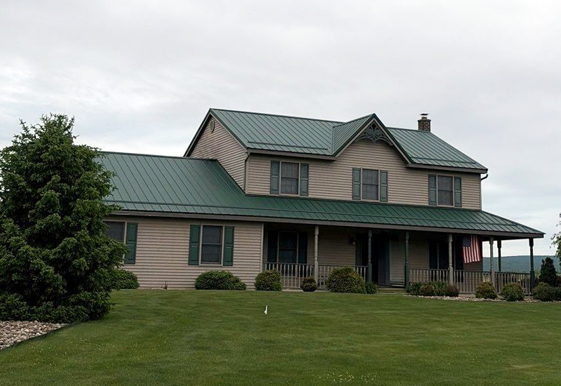 large complex home with exposed fastener metal roof