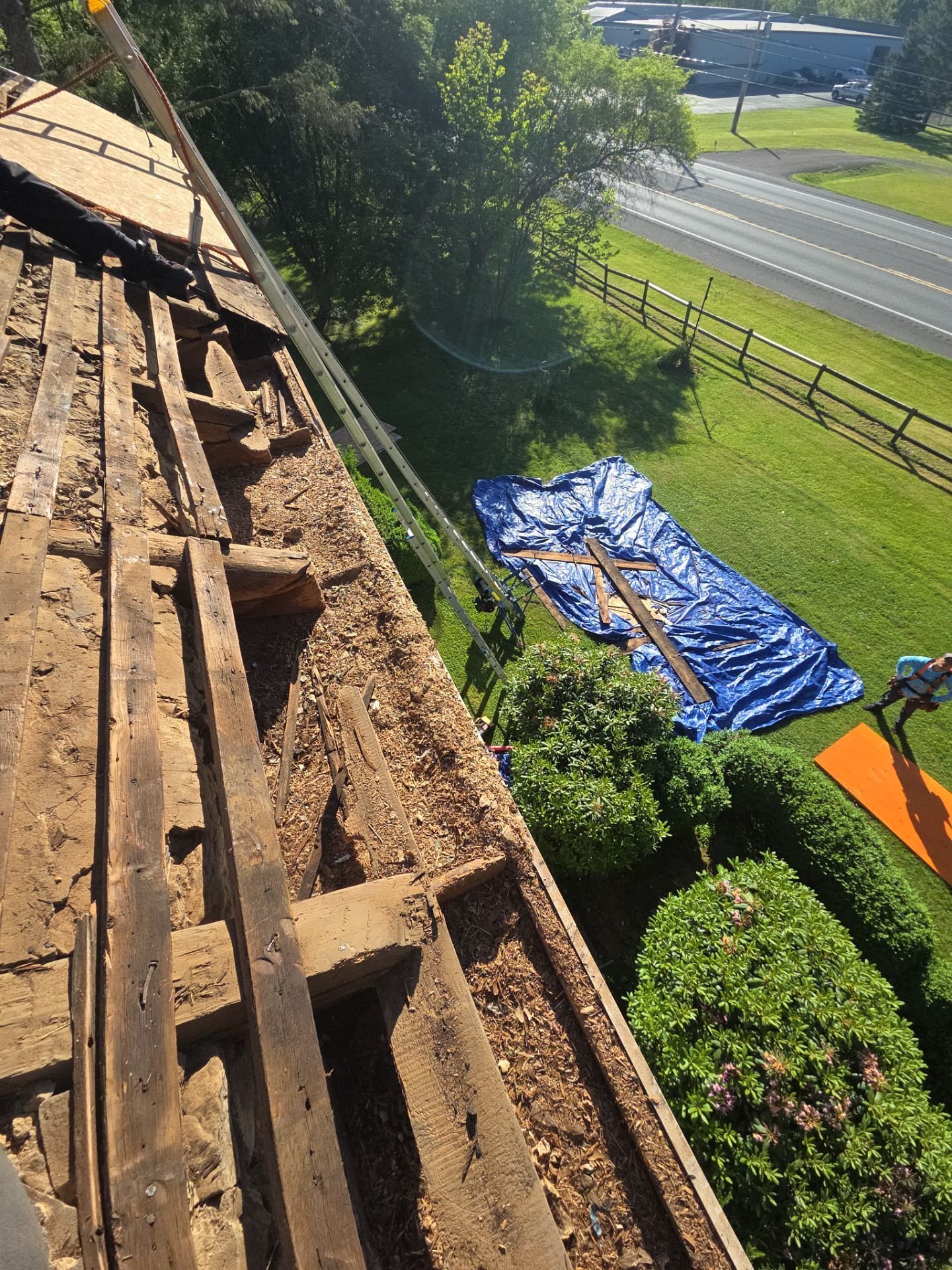 standing seam tear off with protective tarping for landscaping in PA